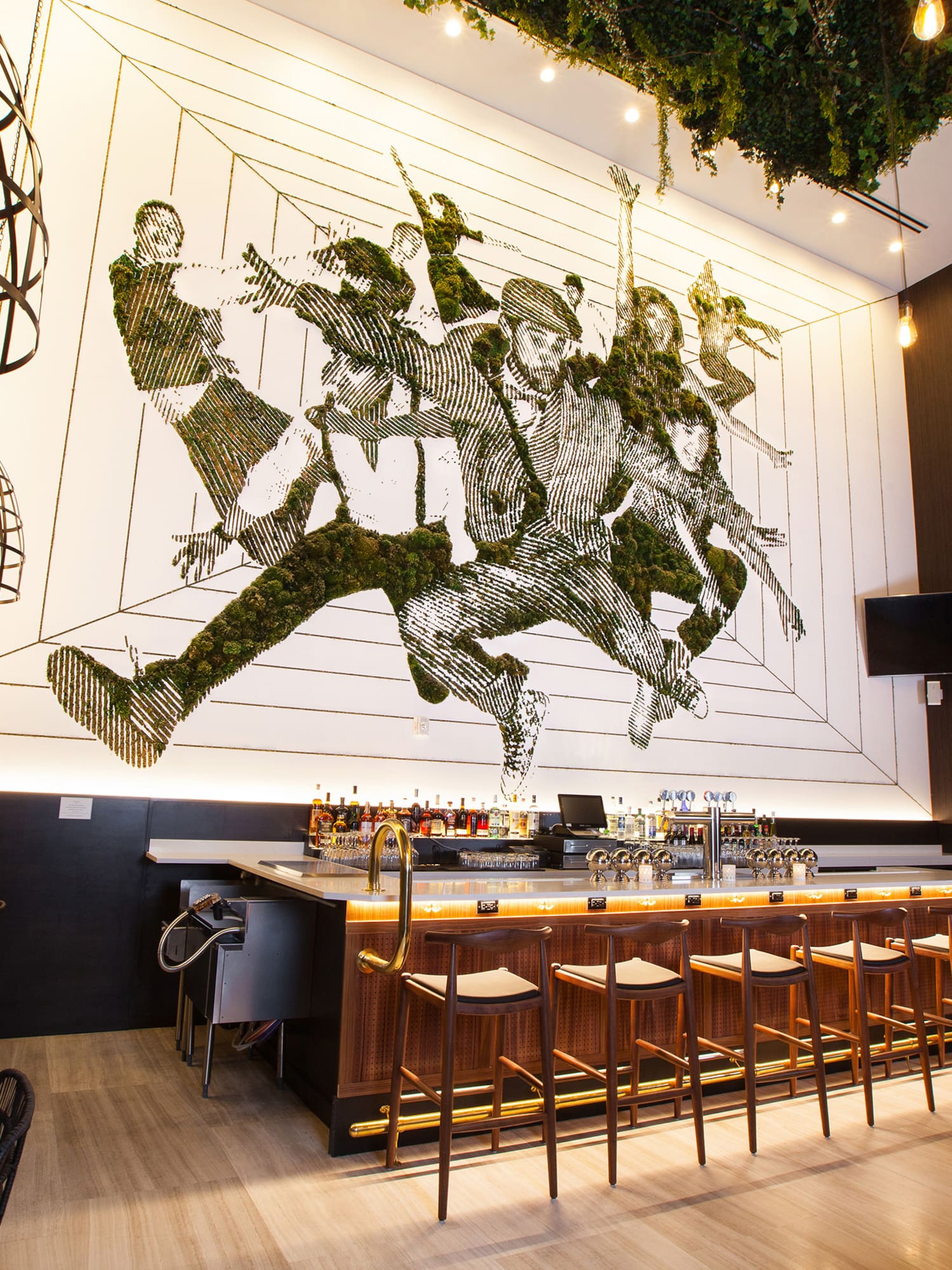 a bar with a painting on the wall