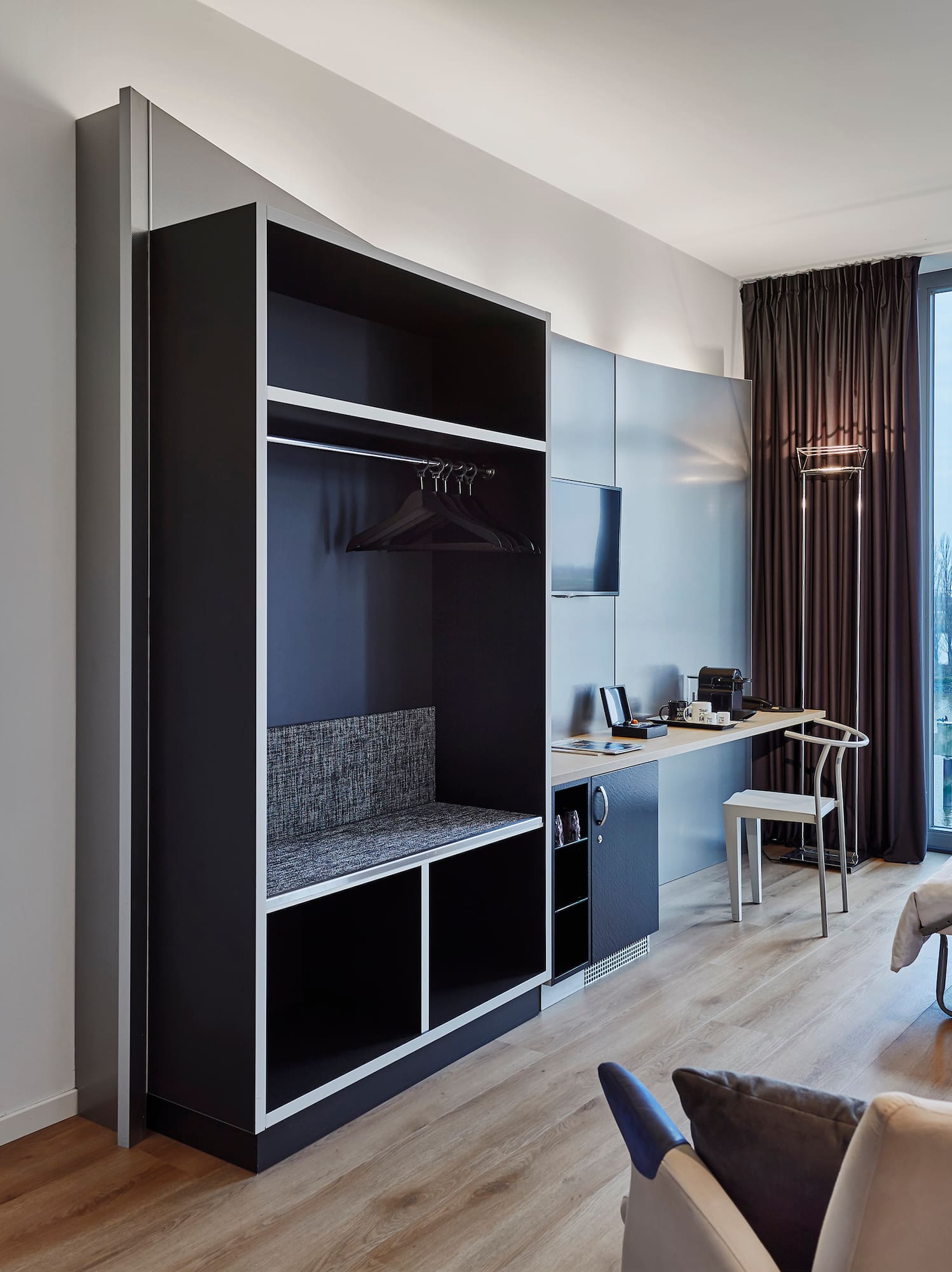 a room with a bed and a desk