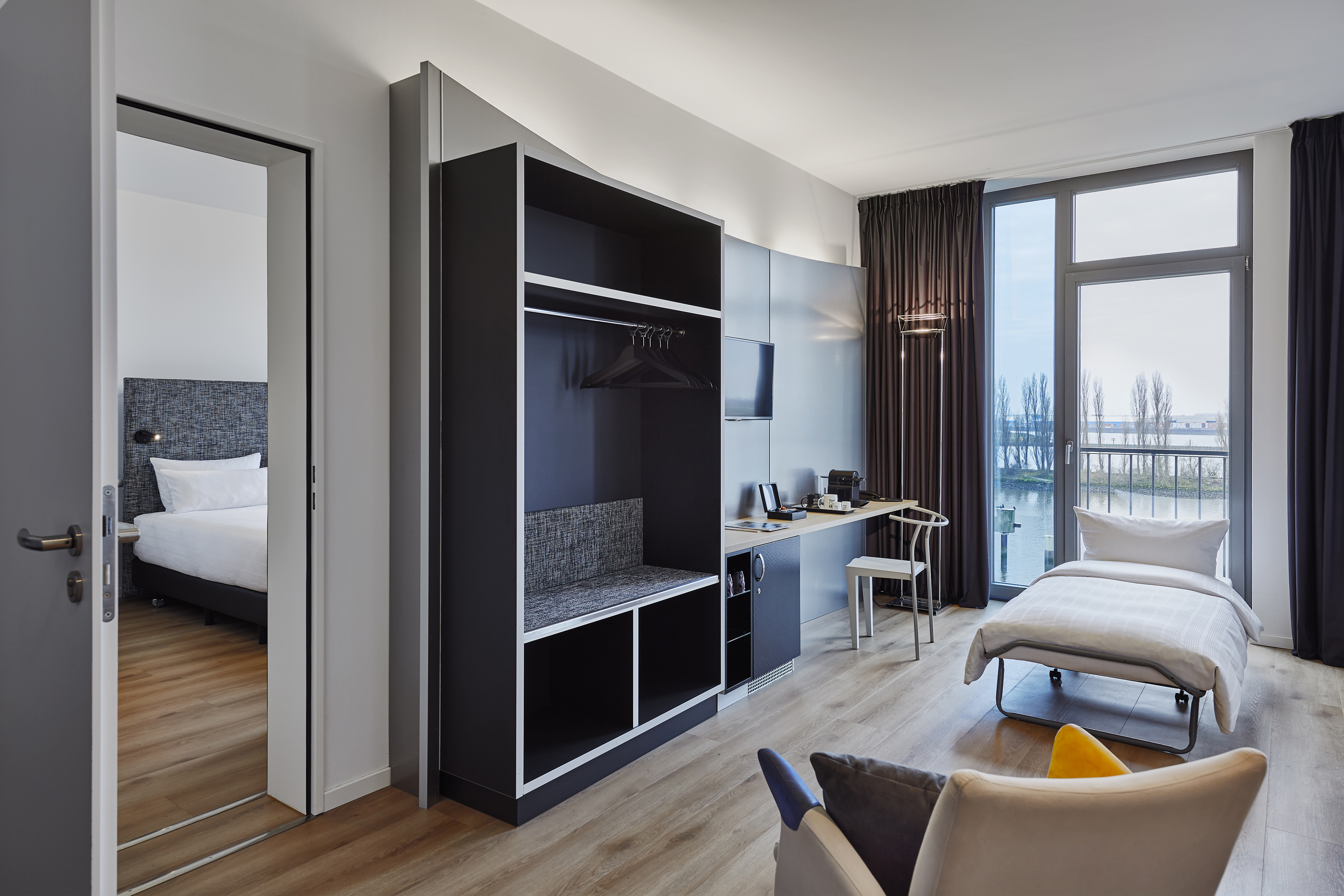 a room with a bed and a desk