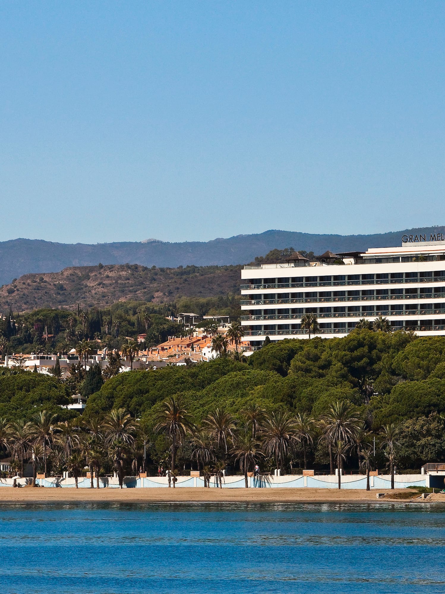 a building next to a body of water