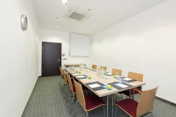 a room with a table and chairs