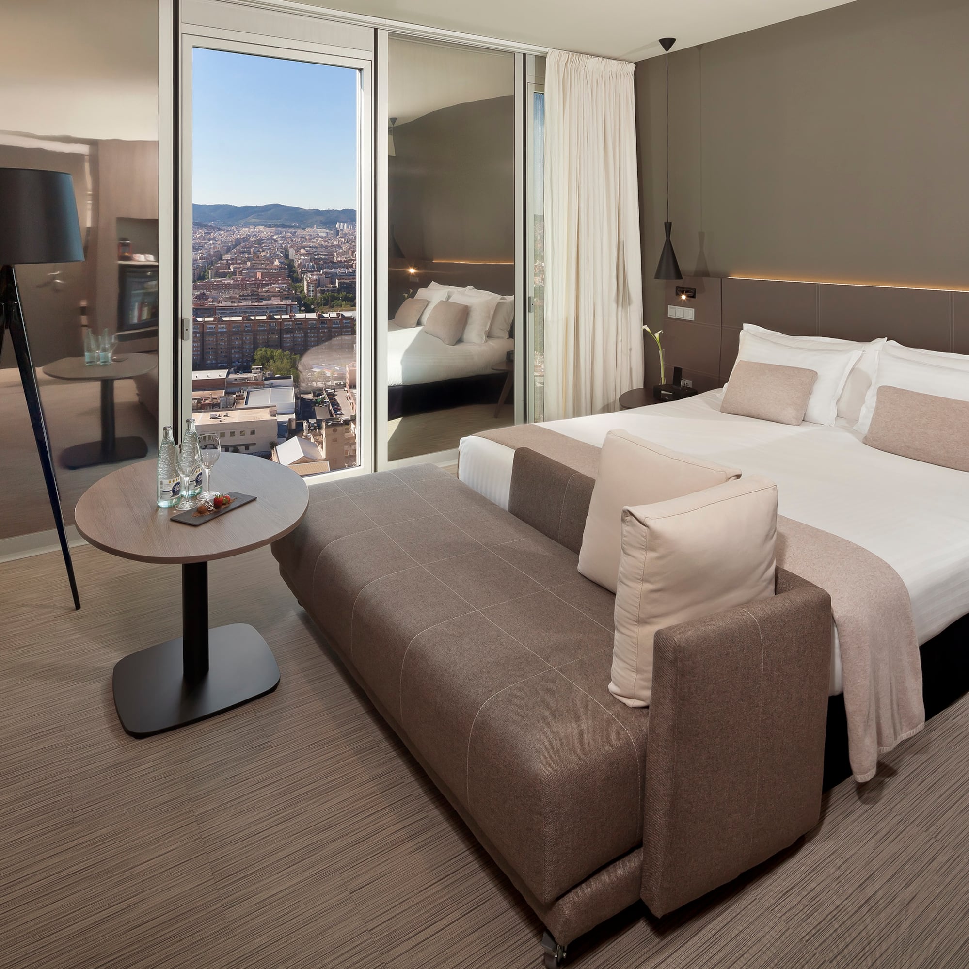 a bedroom with a bed and a table