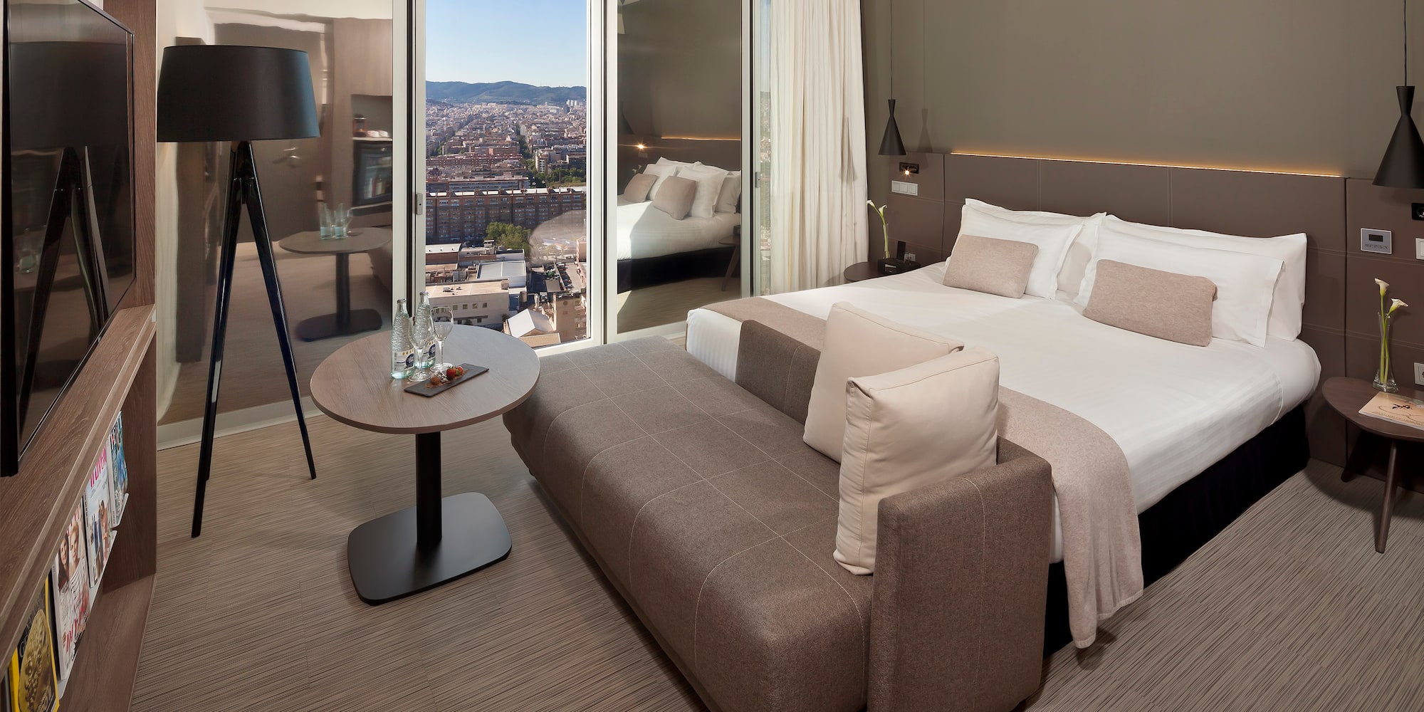 a bedroom with a bed and a table