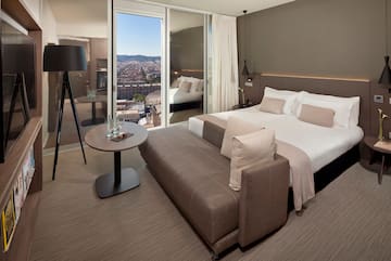 a bedroom with a bed and a table
