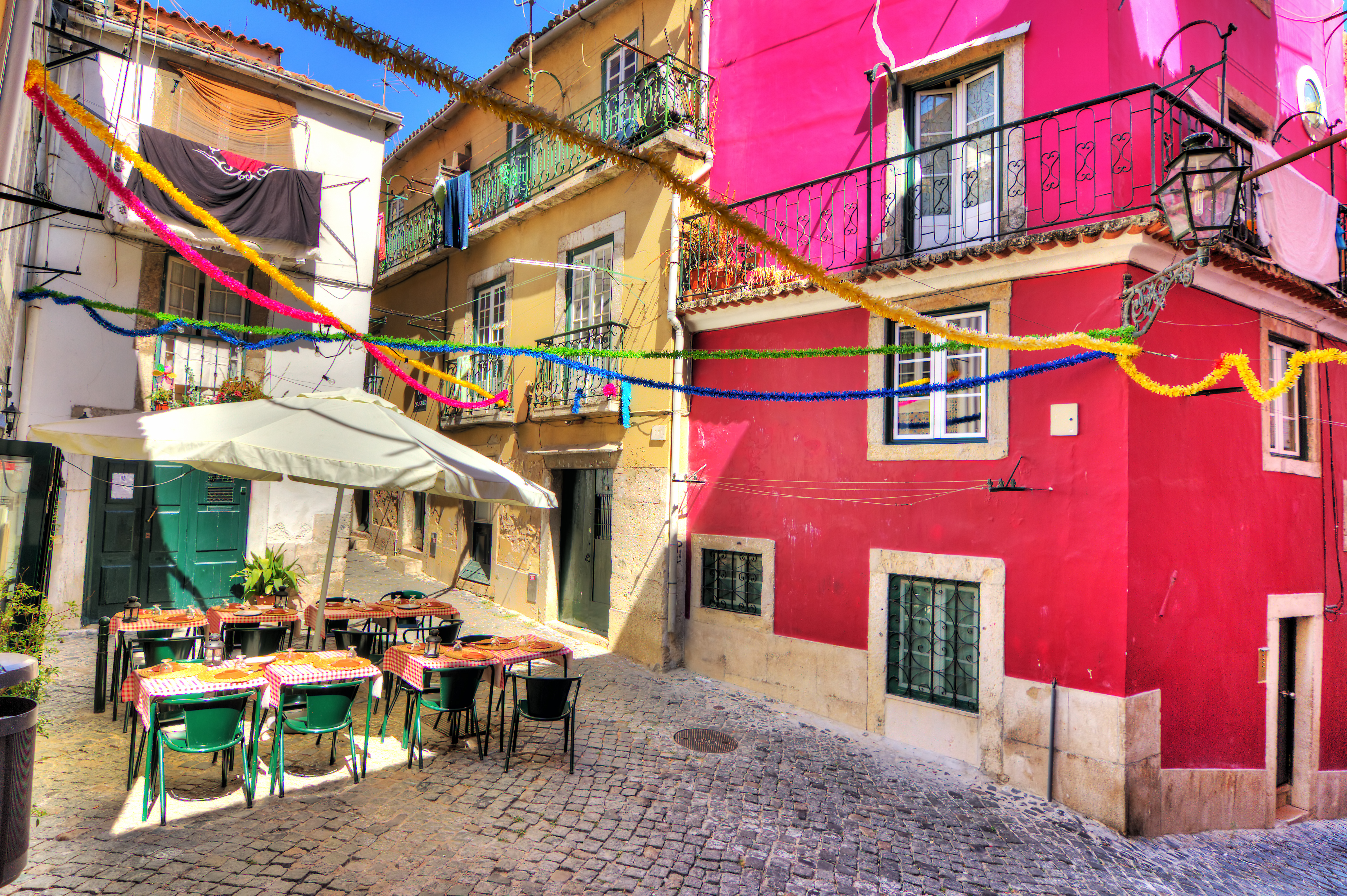 a colorful building with tables and chairs