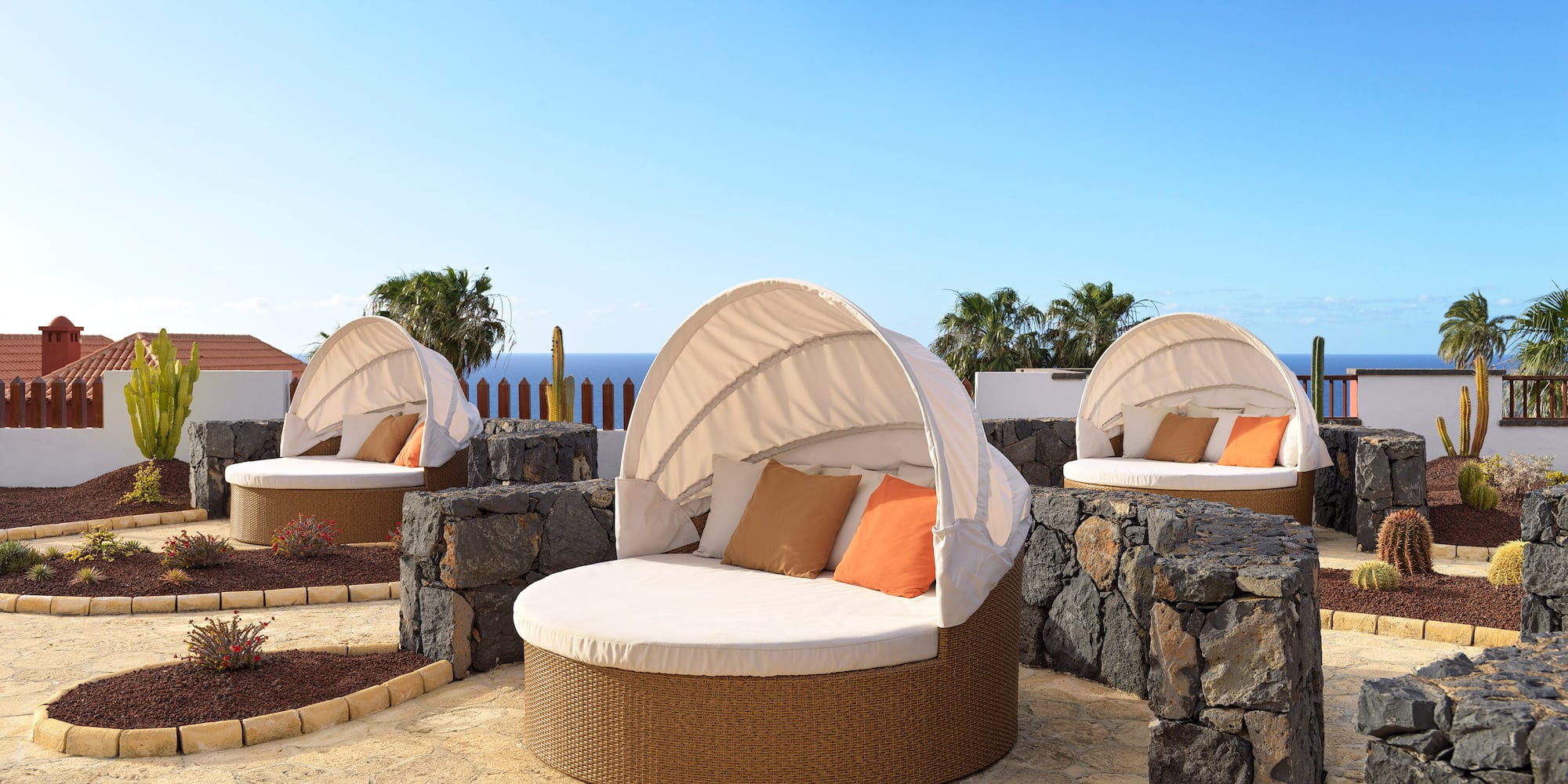 a group of chairs with a canopy