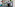 Classic Paris street with Metro sign and Paris Opera 5-star hotel facade.