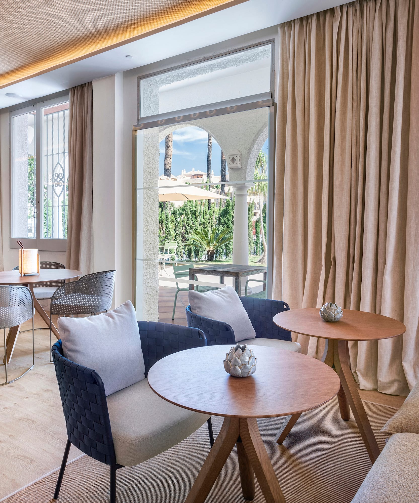 a room with a couch and tables