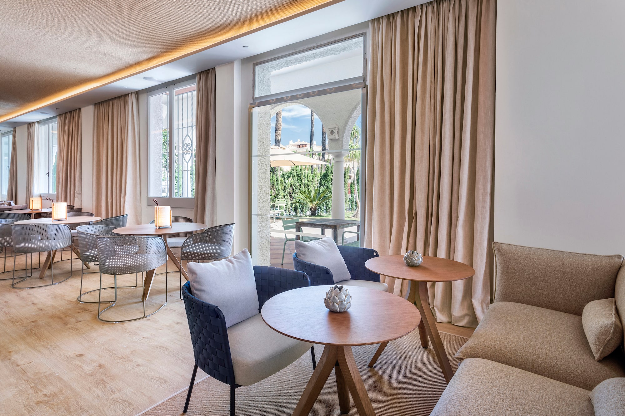 a room with a couch and tables