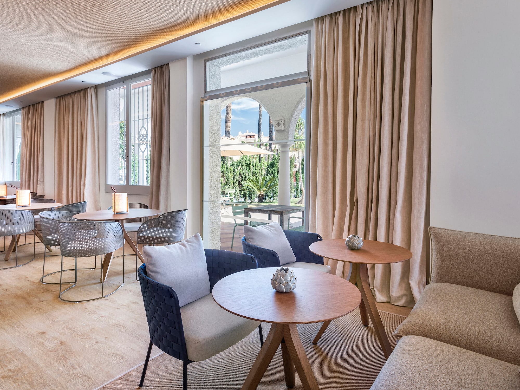 a room with a couch and tables