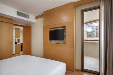 a room with a television on the wall