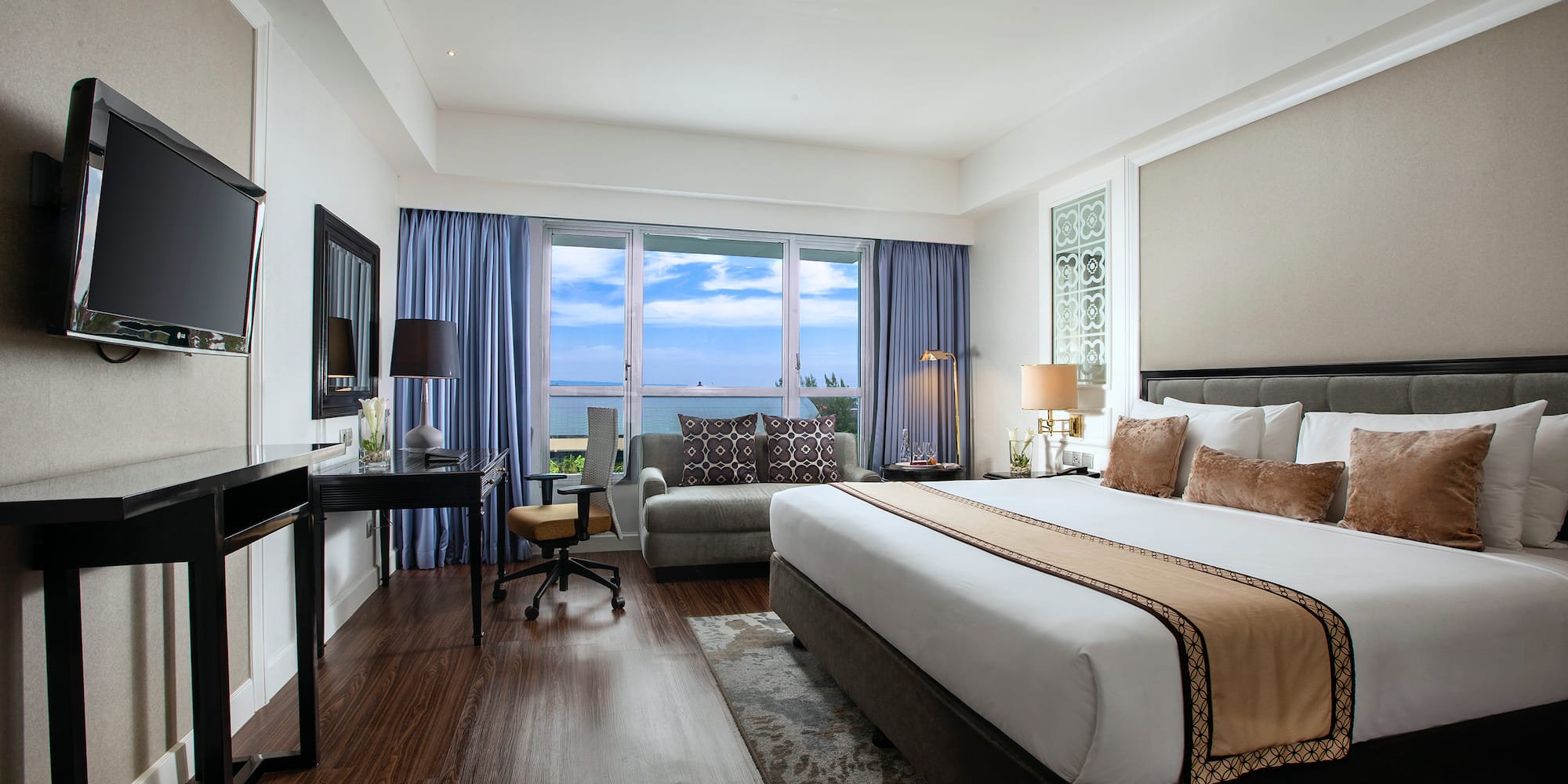 a room with a bed and a desk and a chair