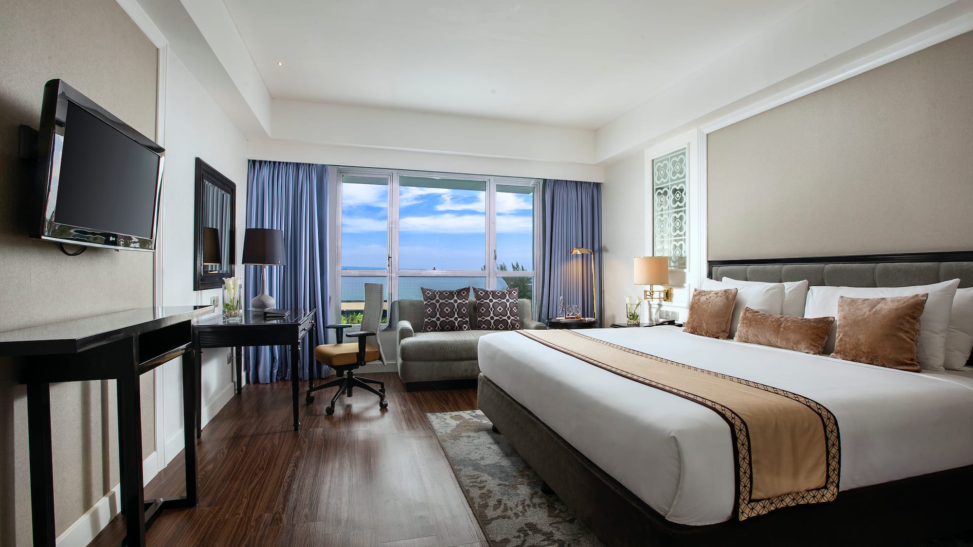 a room with a bed and a desk and a chair