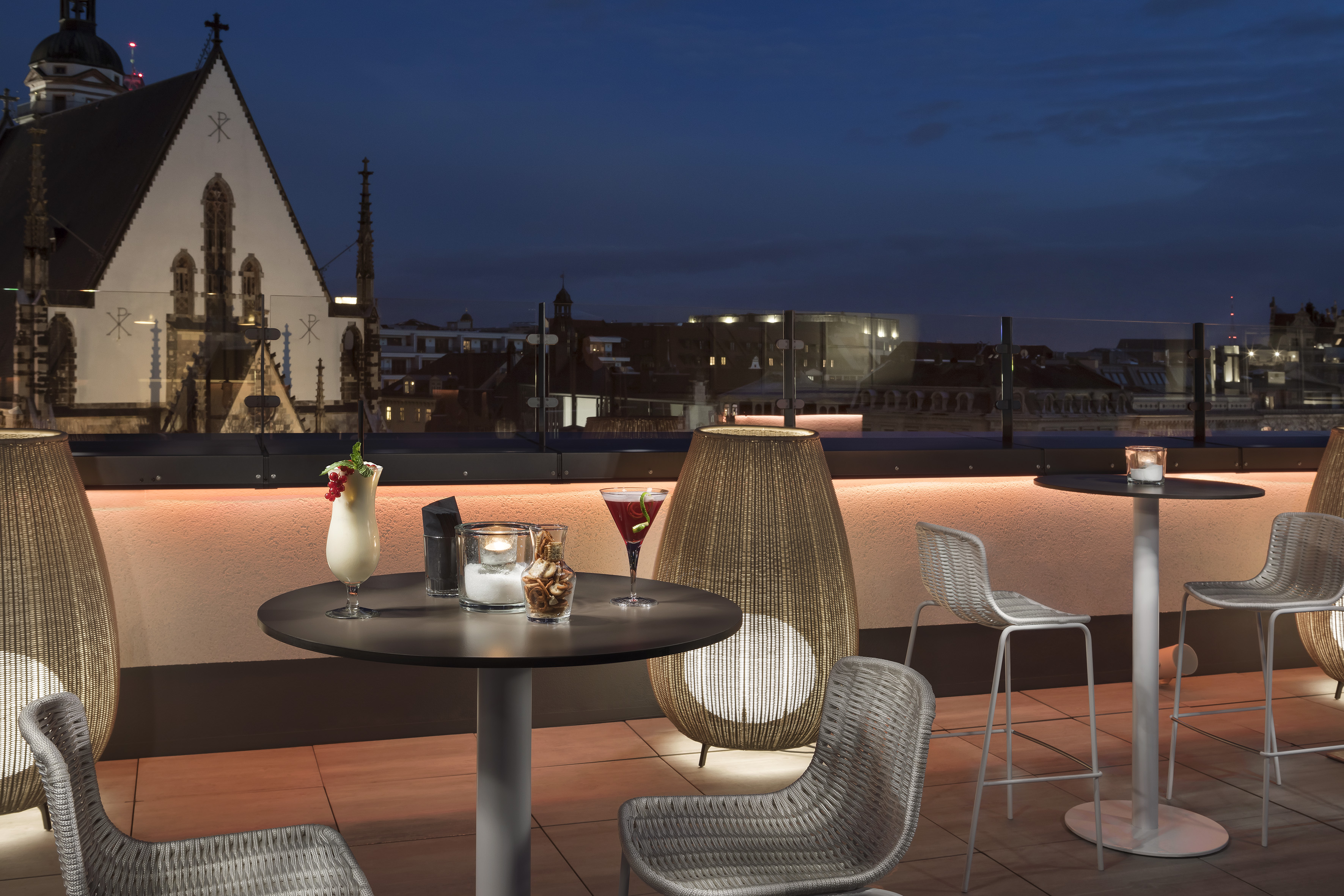 a table and chairs on a rooftop