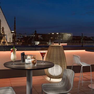 a table and chairs on a rooftop