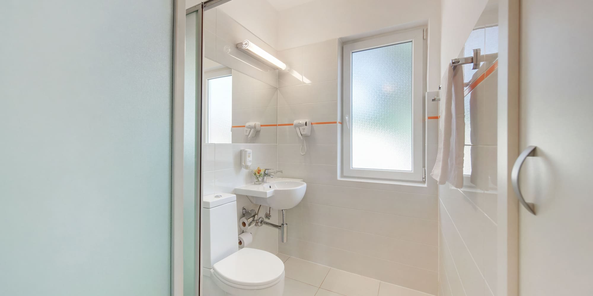 a bathroom with a toilet and sink