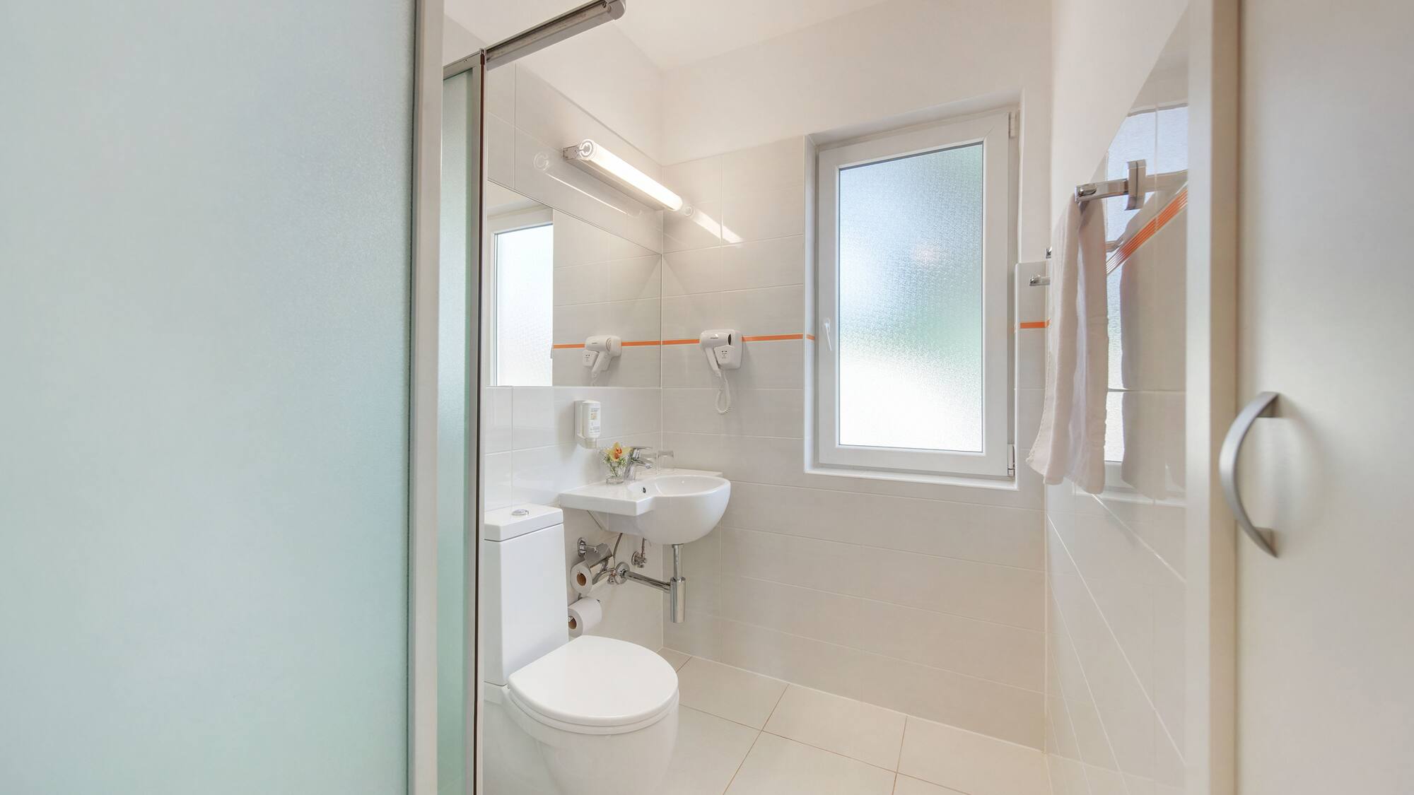 a bathroom with a toilet and sink