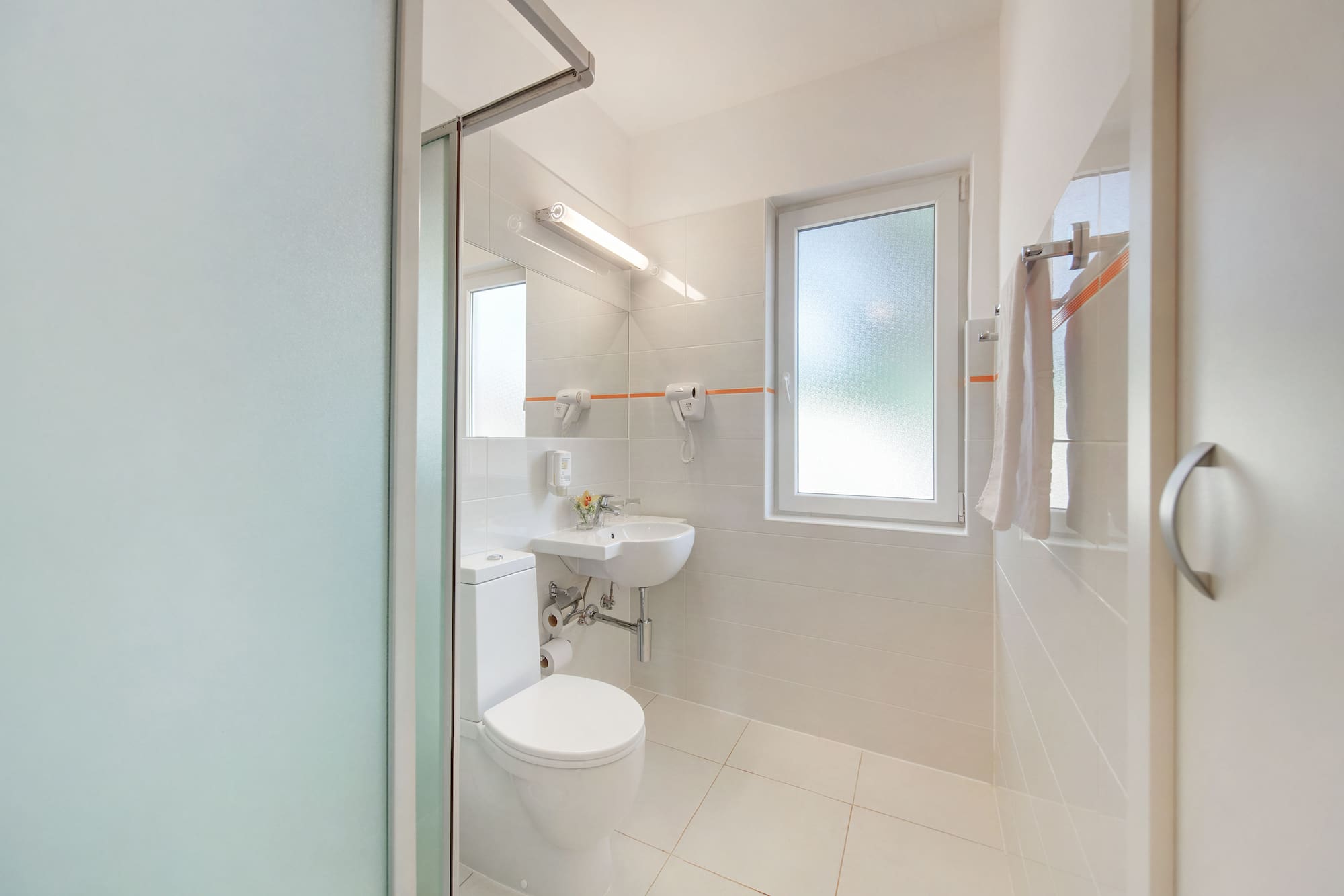 a bathroom with a toilet and sink