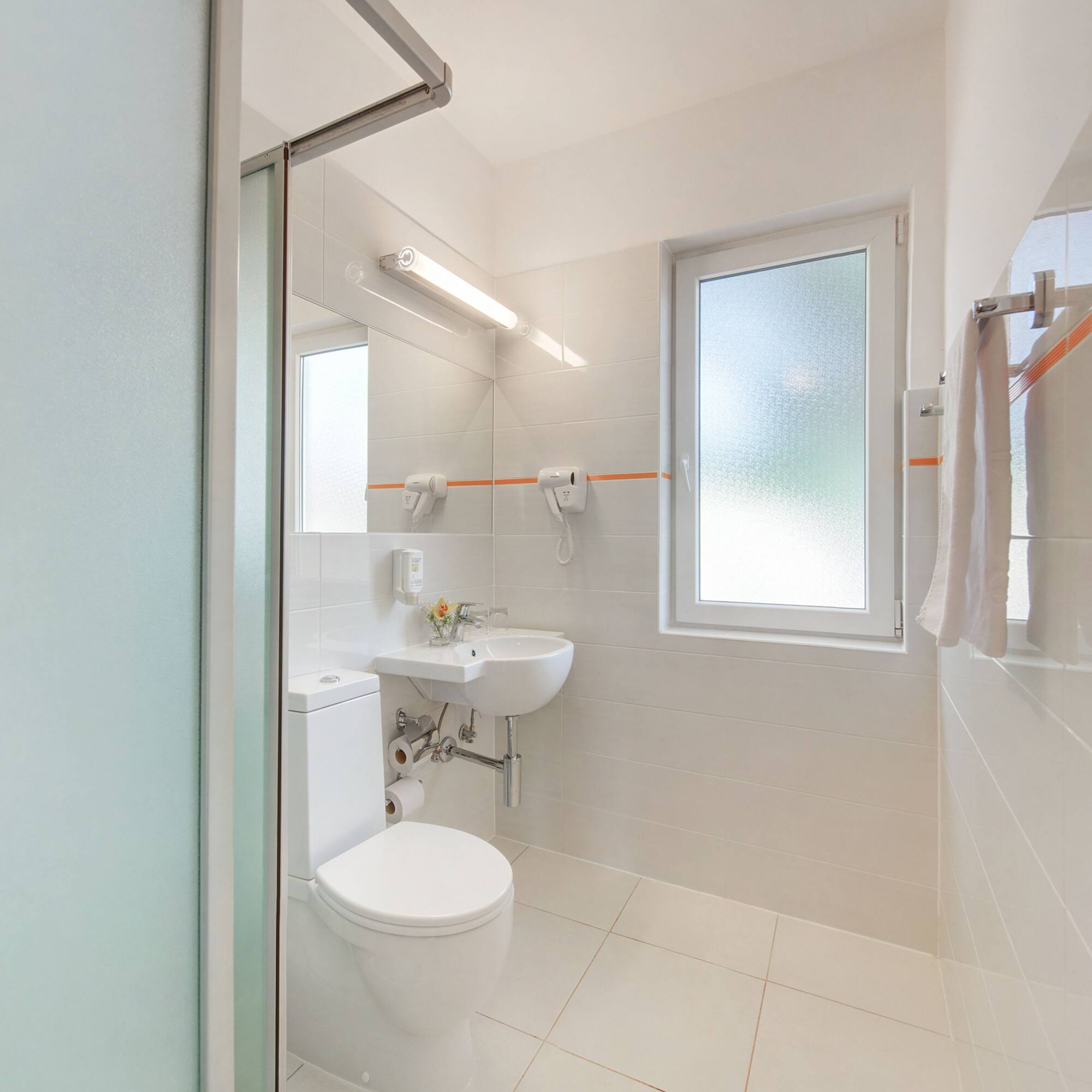 a bathroom with a toilet and sink