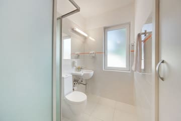 a bathroom with a toilet and sink