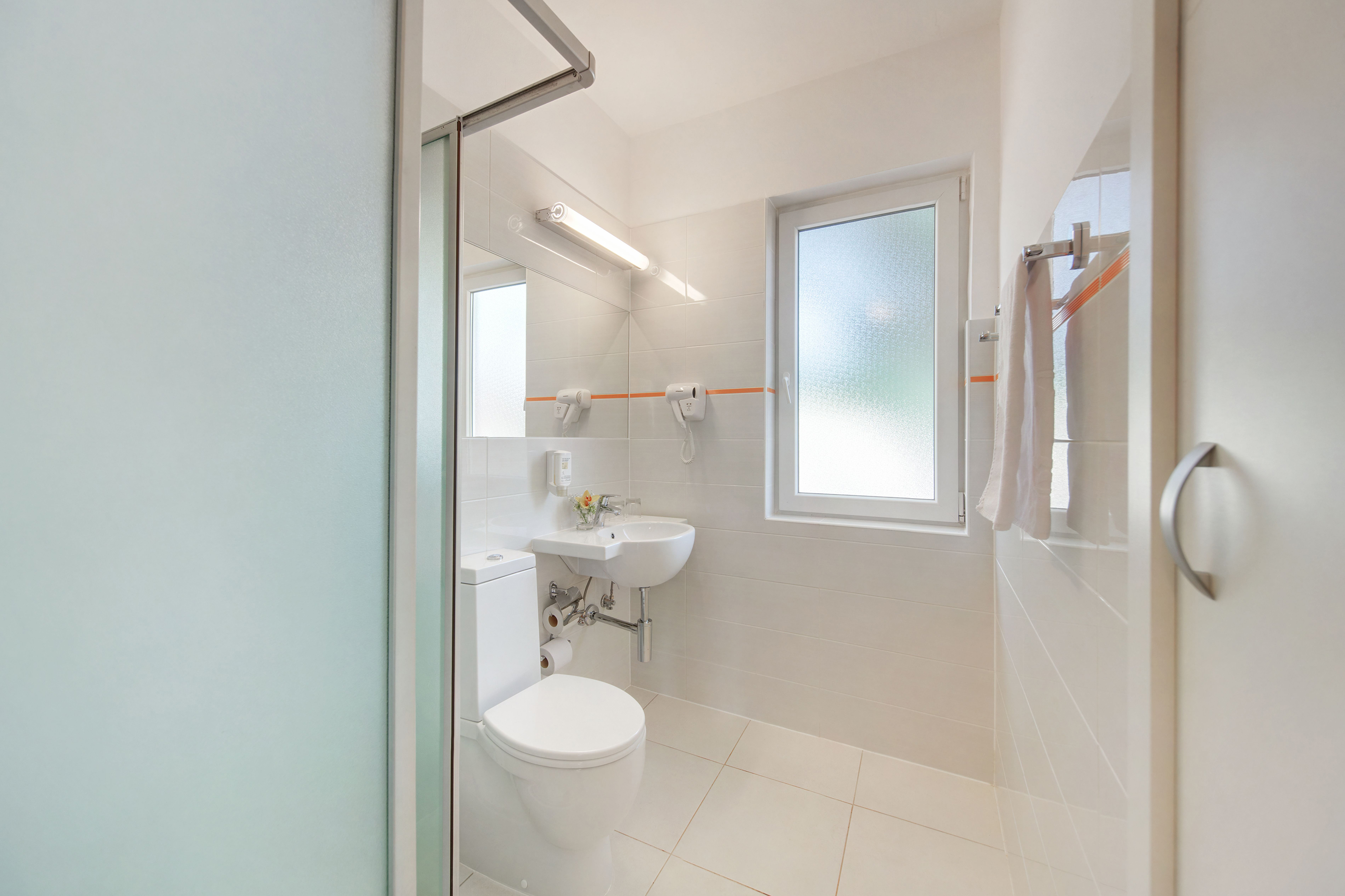 a bathroom with a toilet and sink