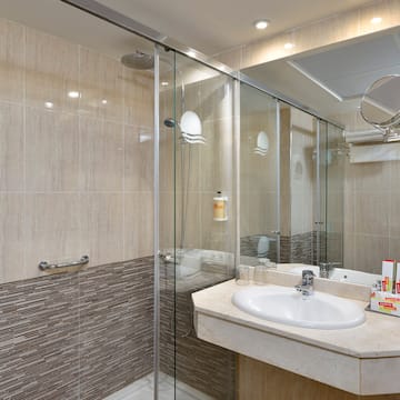 a bathroom with a shower and sink