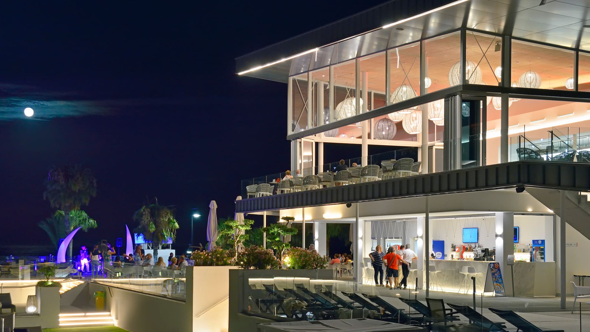 a building with a balcony and people outside