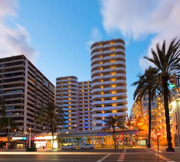 a street with palm trees and buildings