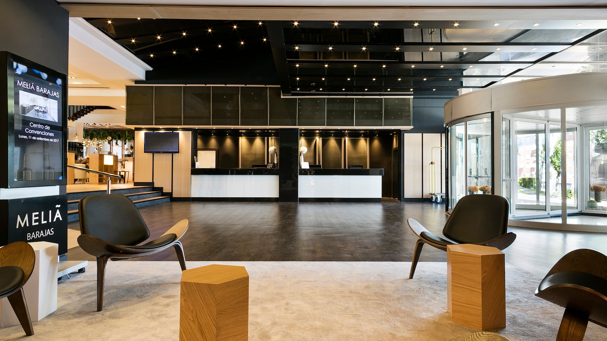 a room with chairs and a reception desk