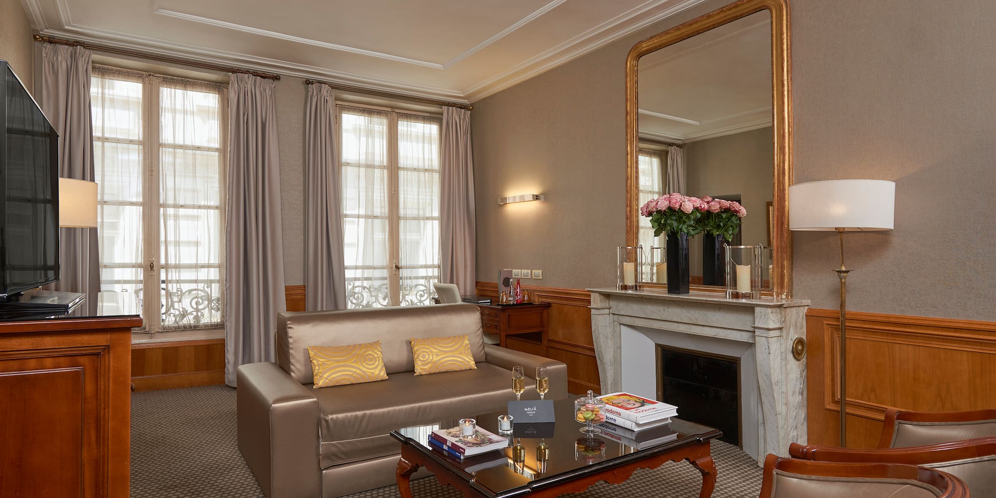 a living room with a fireplace and couch