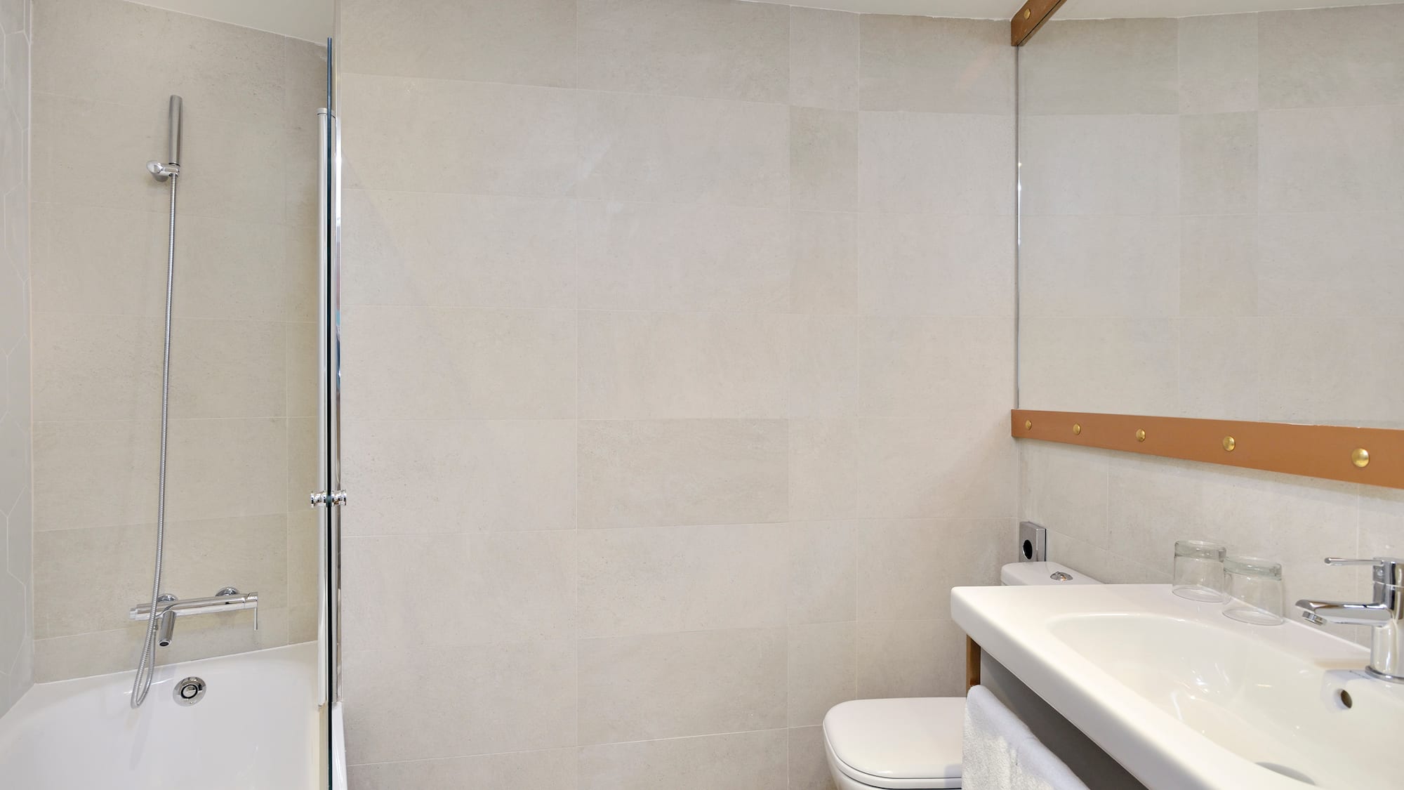 a bathroom with a shower and toilet