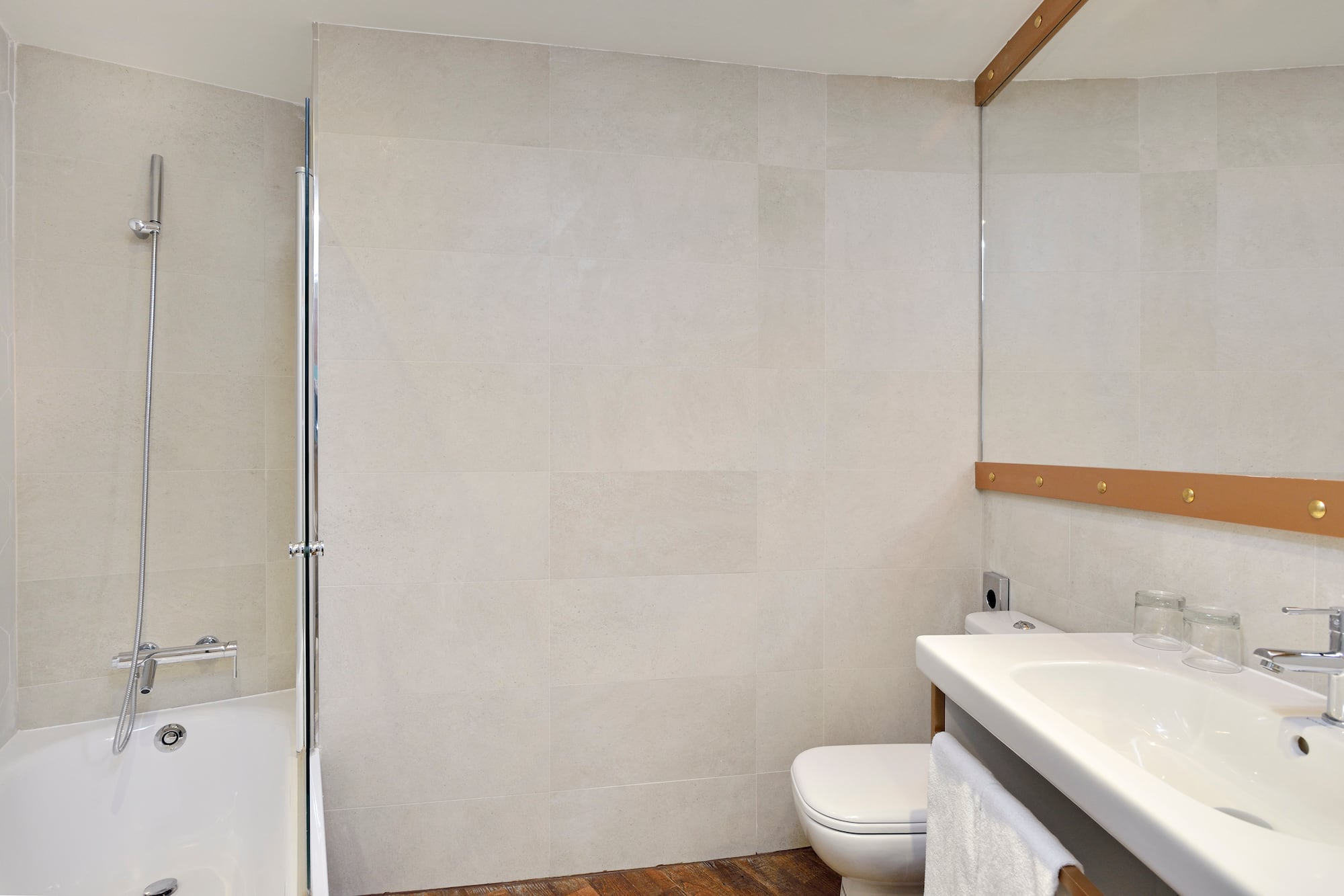 a bathroom with a shower and toilet