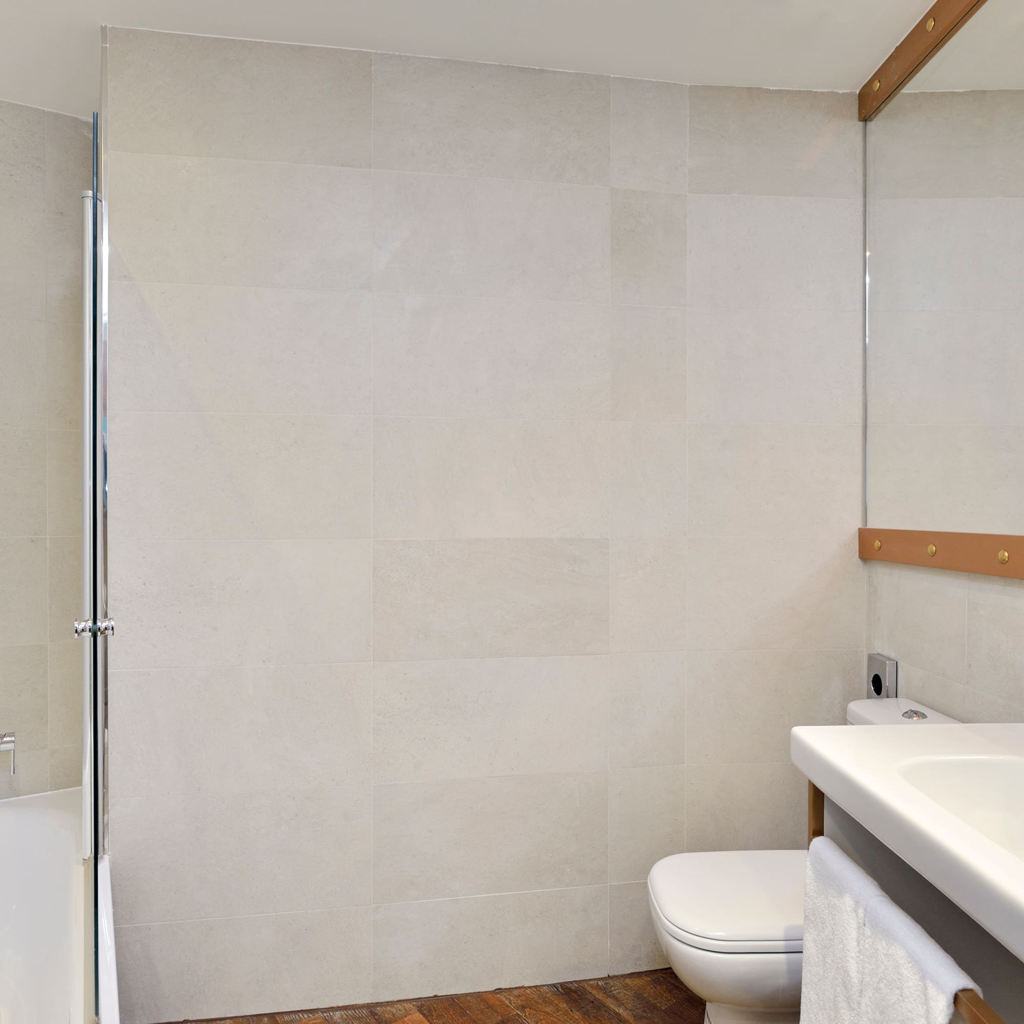 a bathroom with a shower and toilet