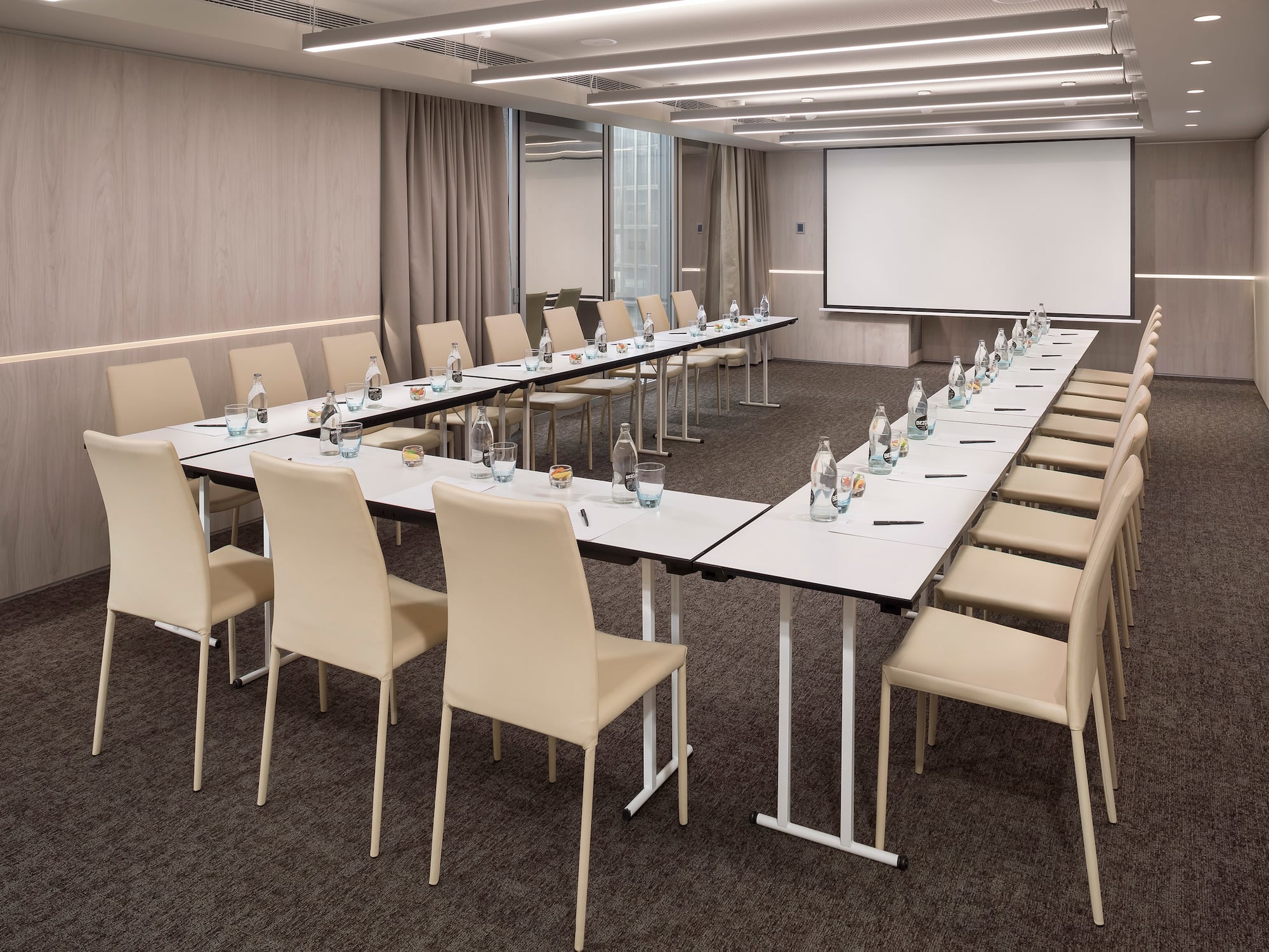 a room with a large table and chairs