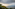 a view of a valley and mountains from a mountain