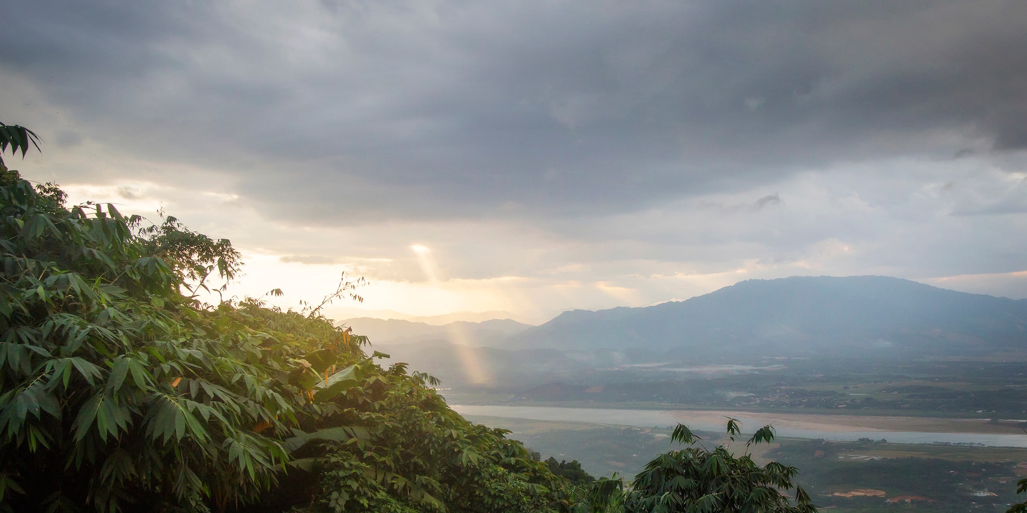 a view of a valley and mountains from a mountain