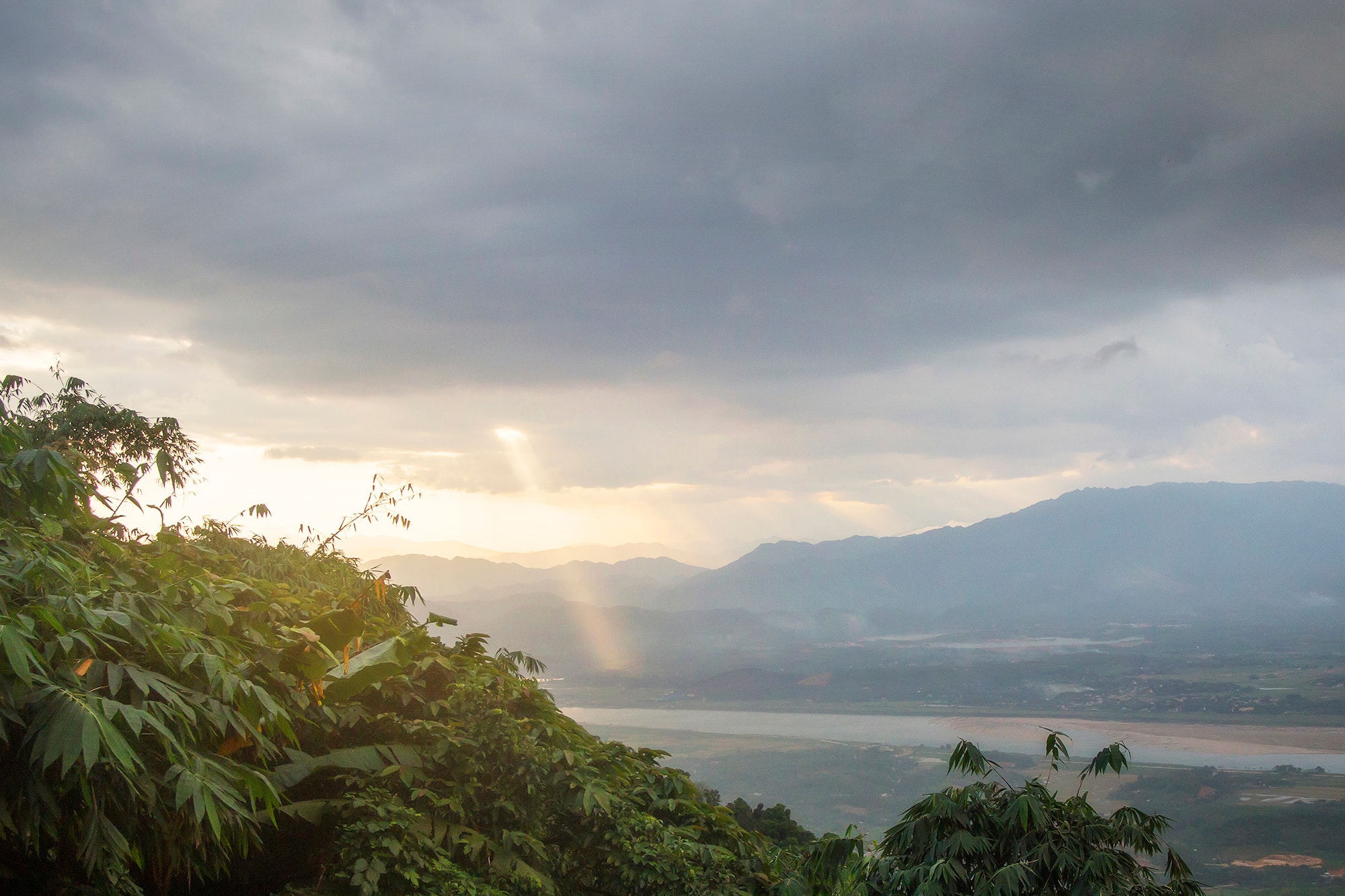 a view of a valley and mountains from a mountain
