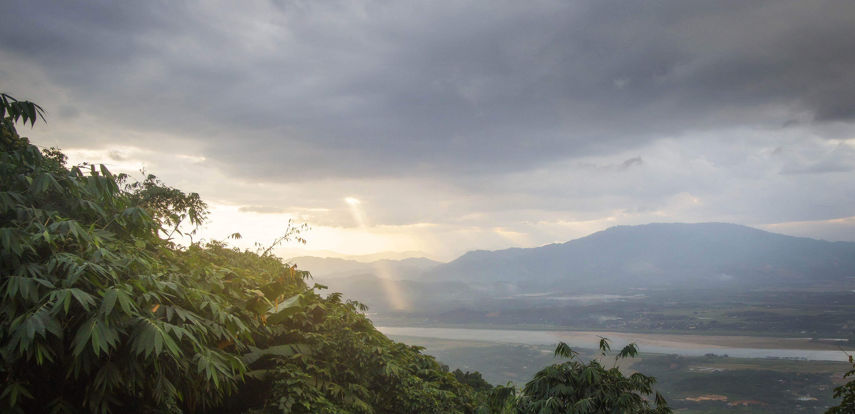 a view of a valley and mountains from a mountain
