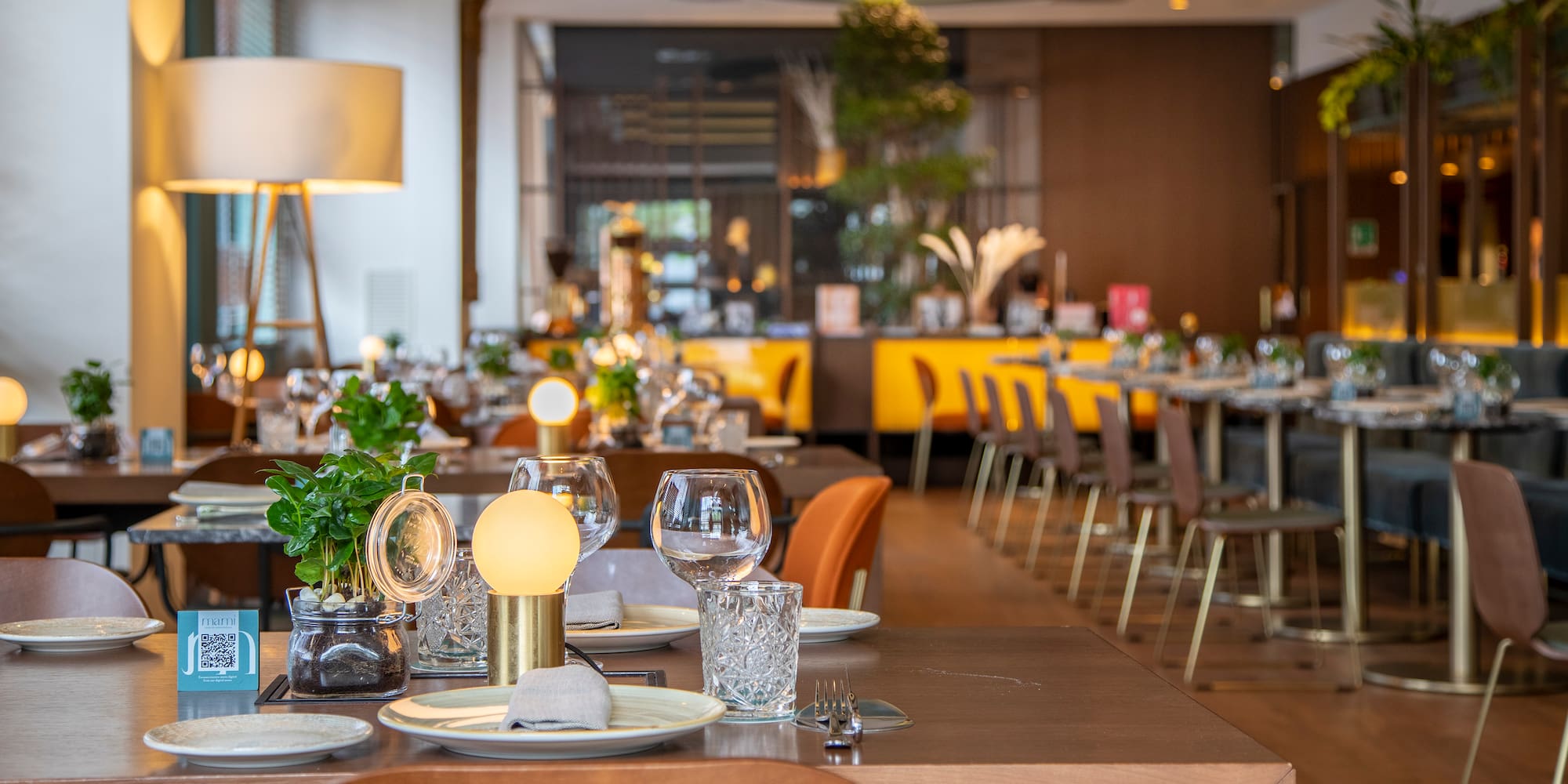 a restaurant with tables and chairs