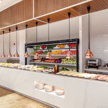 a food buffet with different types of food on shelves