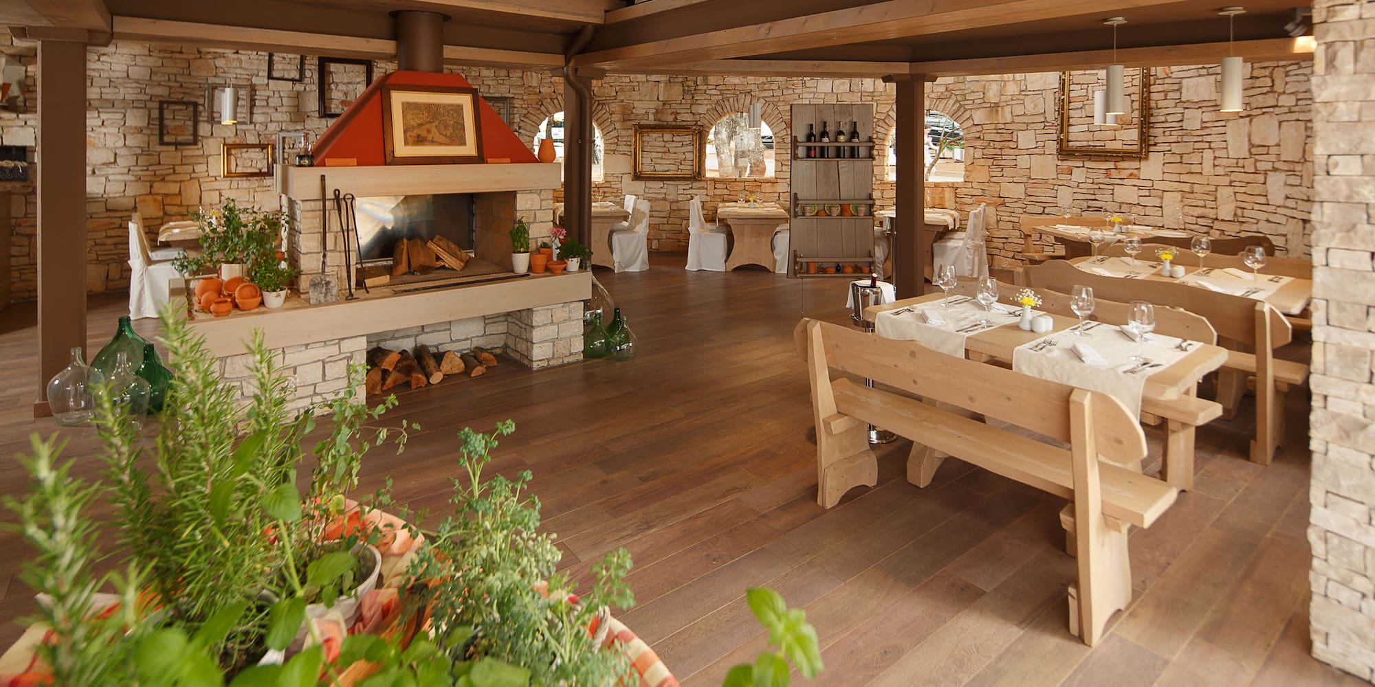 a room with a table and chairs and a fireplace