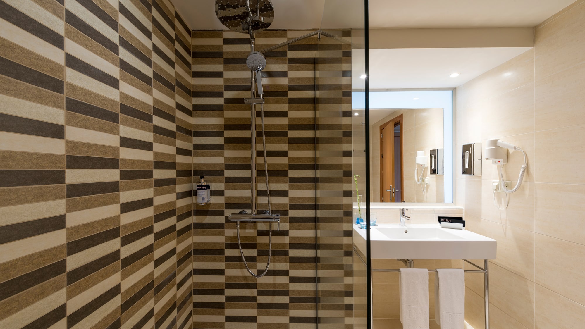 a bathroom with a shower and sink