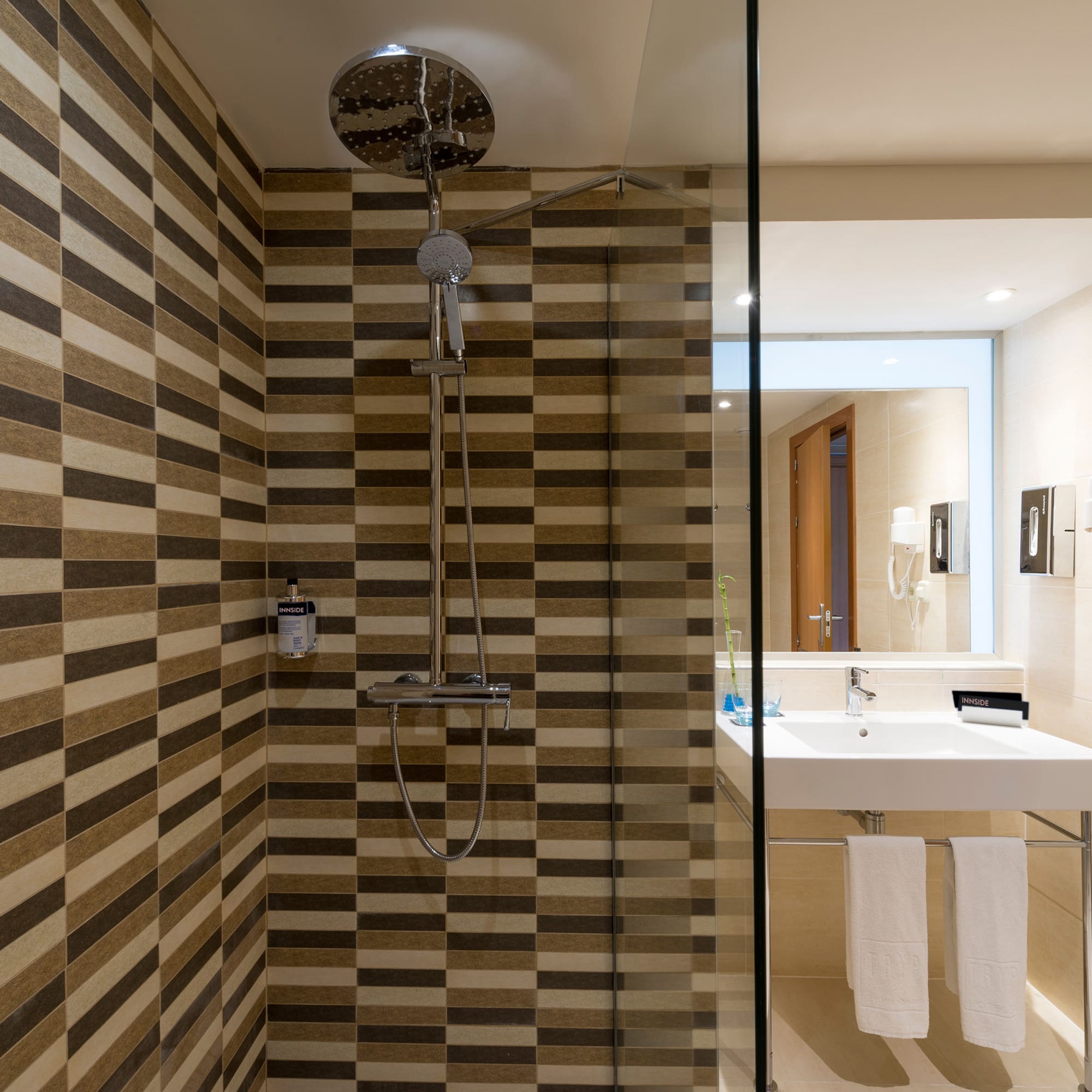 a bathroom with a shower and sink