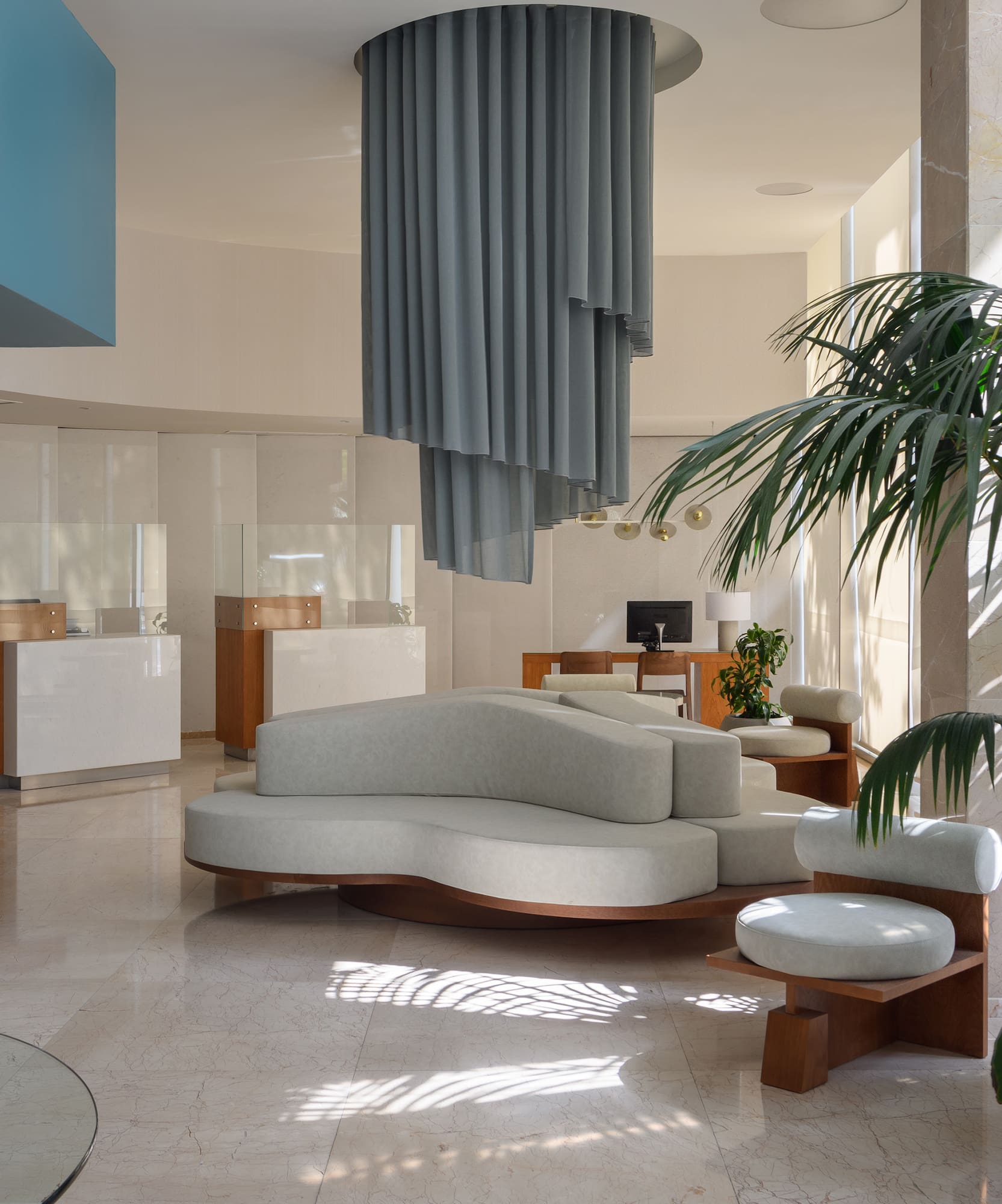 a room with a couch and a plant