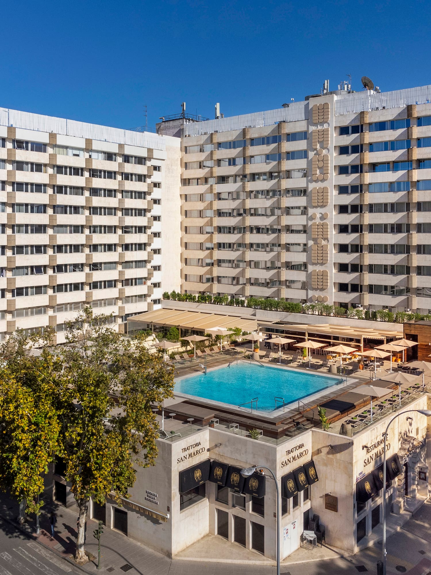 a building with a pool in the middle of it