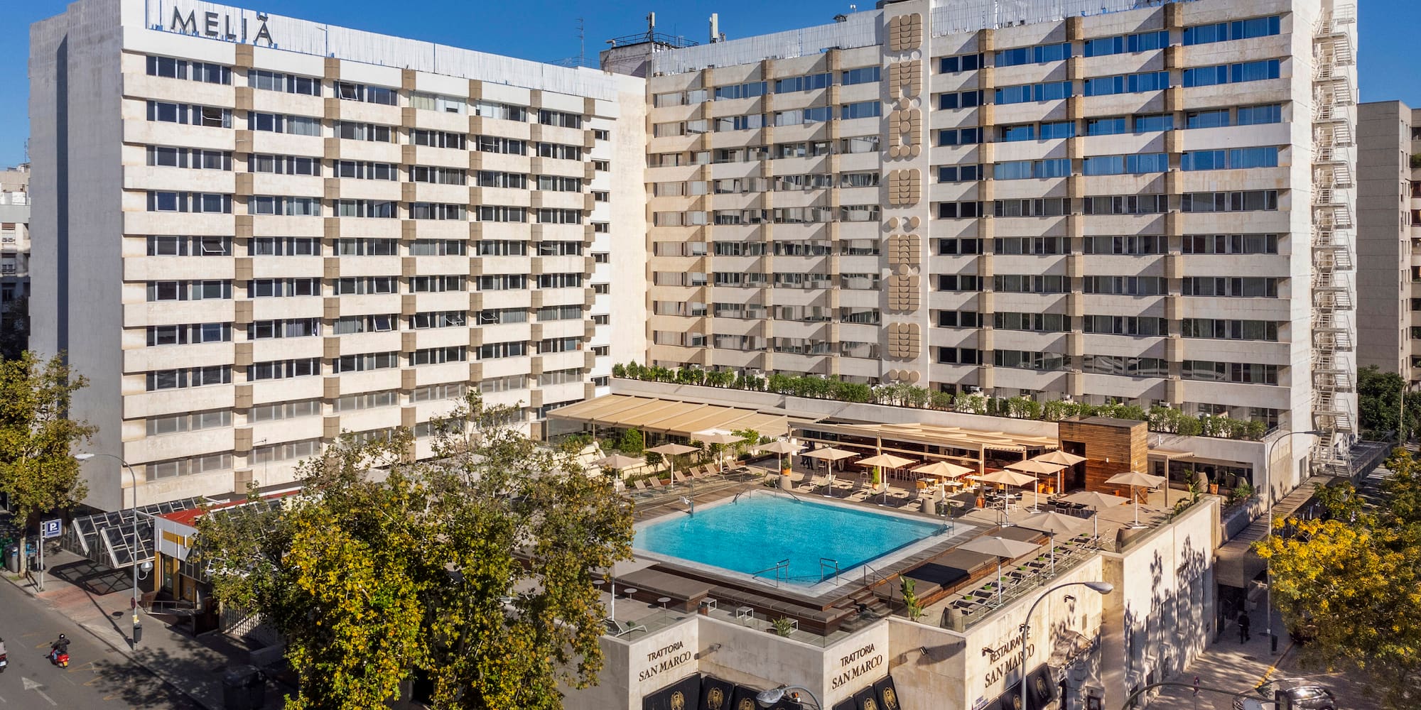 a building with a pool in the middle of it