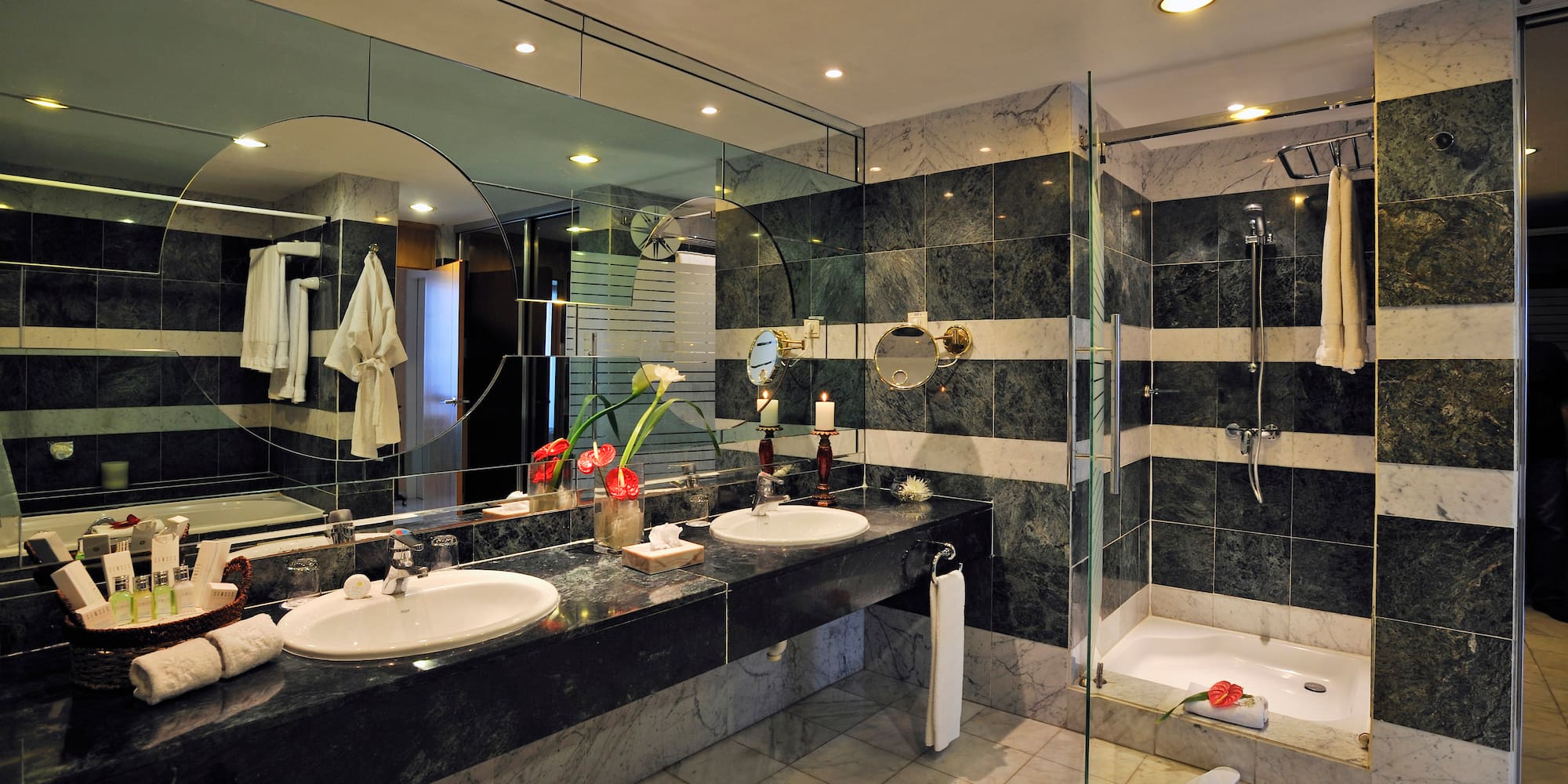 a bathroom with a large mirror and sinks