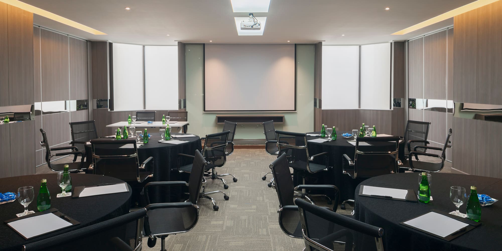 a room with black chairs and tables