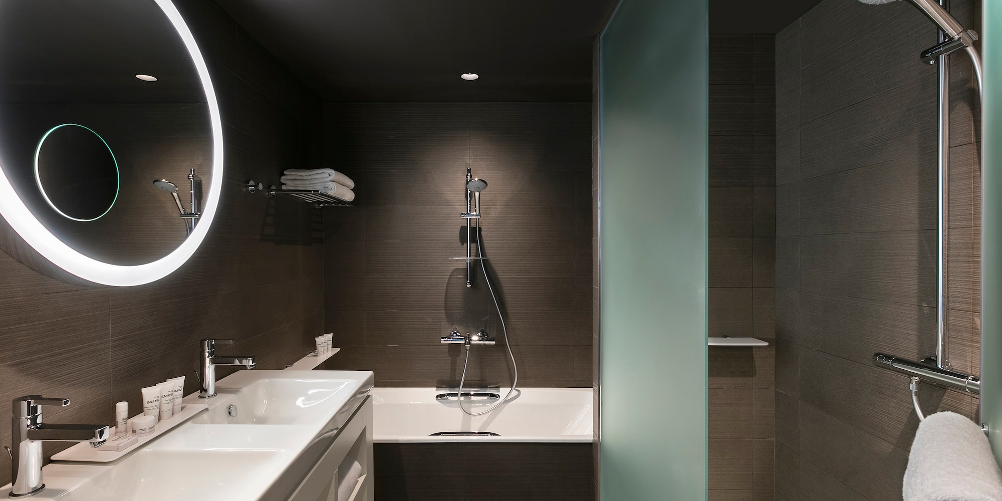 a bathroom with a shower and sink