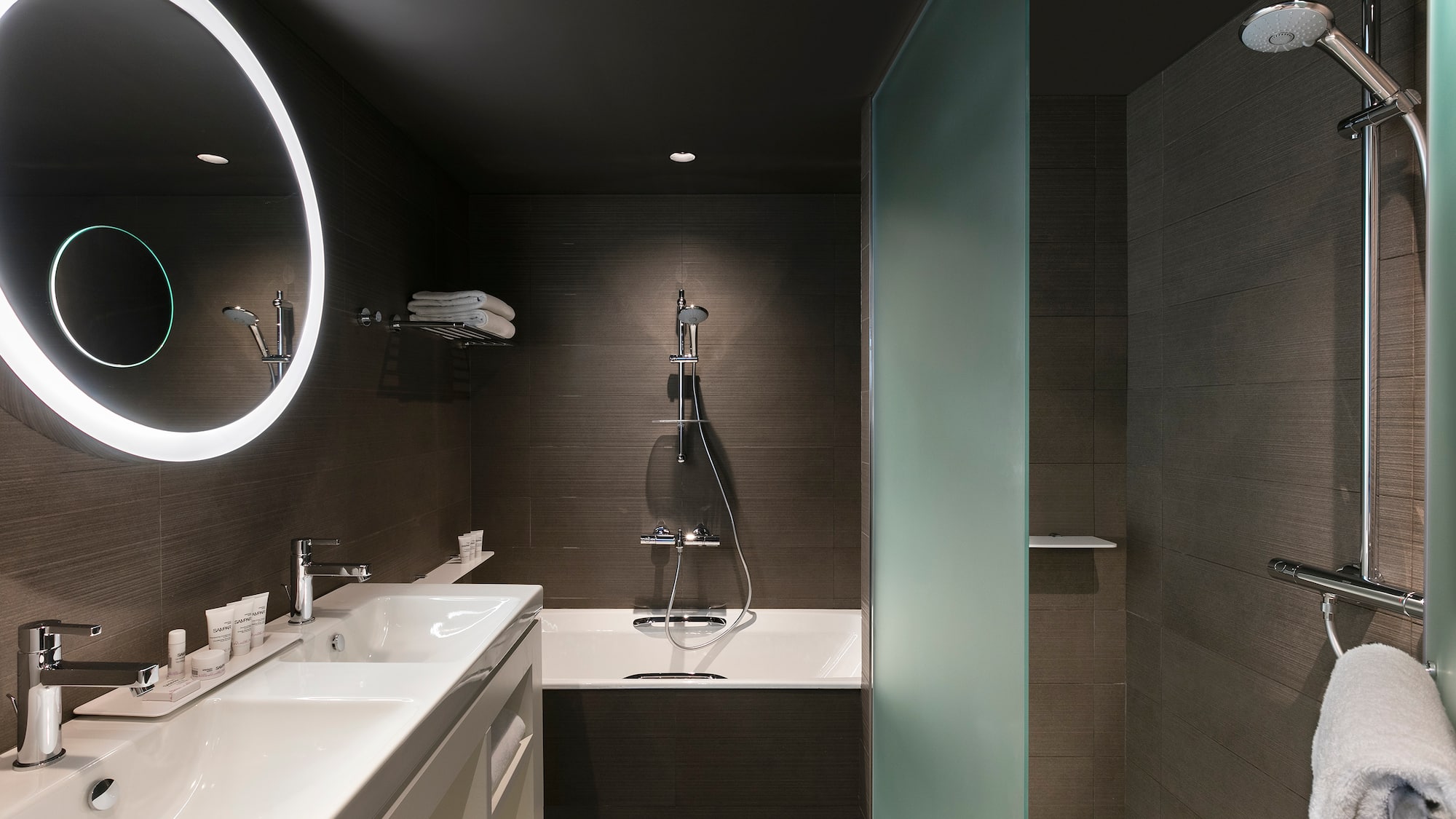 a bathroom with a shower and sink